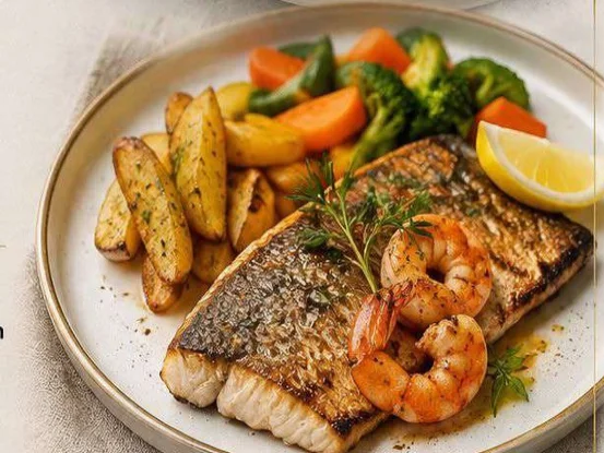 Grilled barramundi with shrimp, fried potato and seasonal vegetables